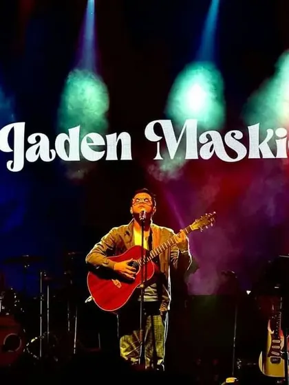 A great shot from our Mumbai show at Market City. The colorful stage lights and my guitar create a classic singer-songwriter concert image.