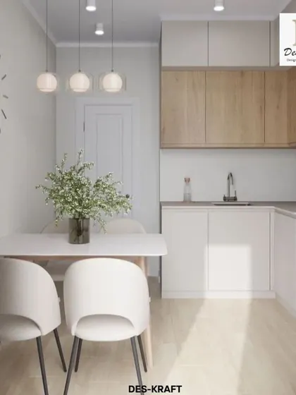 A compact and highly functional kitchen featuring a two-tone design with natural wood upper cabinets and clean white lower cabinets, perfect for modern apartment living.