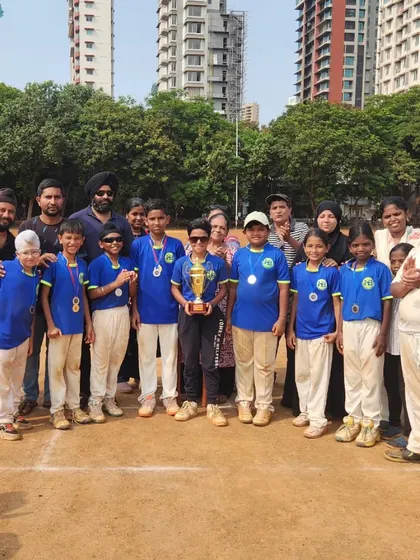 Another victorious team poses with their trophy. The smiles on their faces reflect the joy and satisfaction of achieving their goals through teamwork and perseverance.