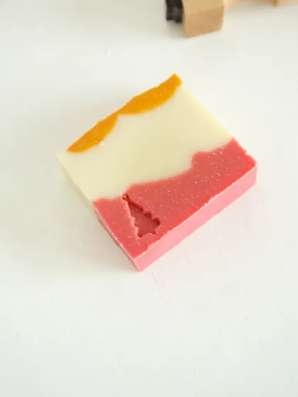 A single bar of 'Herbal Revival' soap with a Christmas tree stamp.