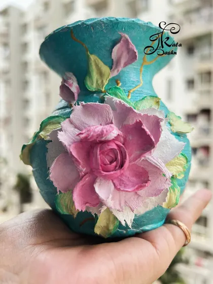Another angle of the small teal vase with the sculpted rose.