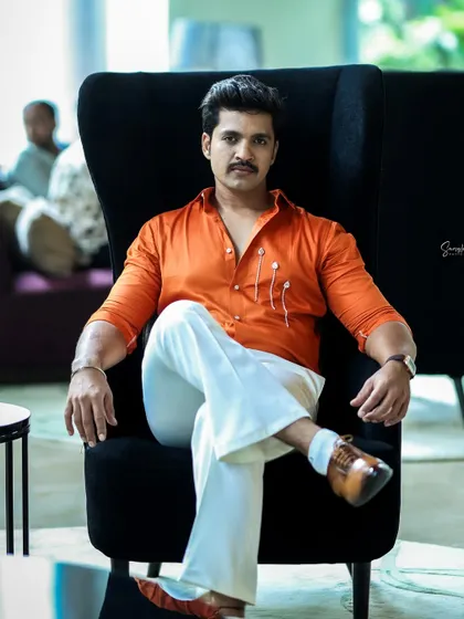 Another dapper shot of Rohit. The grooming is subtle, enhancing his features without looking like he's wearing makeup.