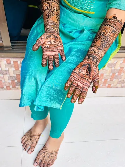 Another angle of the engagement mehendi, showcasing the full set. I ensure the designs on the arms and feet complement each other perfectly.