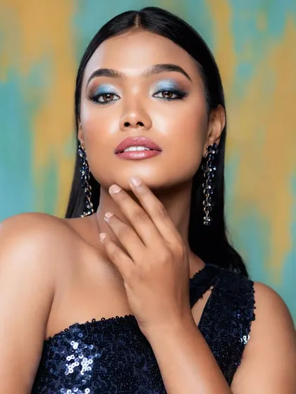 A beauty shot highlighting the stunning blue statement earrings, which are designed to catch the light and draw attention to your face.