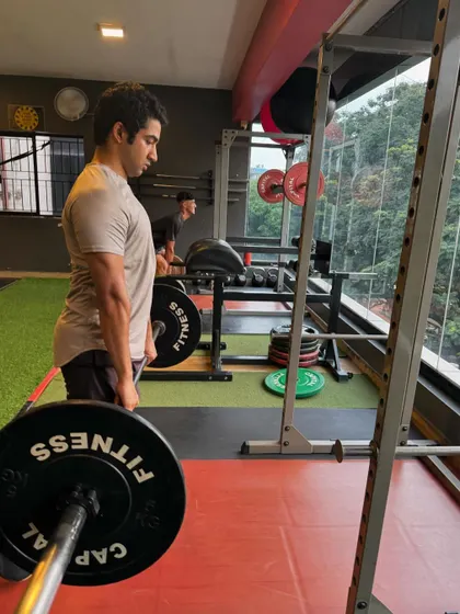 A client focuses on his deadlift form. Proper technique is something we drill into every member to ensure long-term progress and health.
