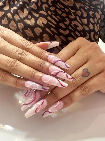 An example of my fine line work. Creating these smooth, consistent swirls requires a steady hand and an eye for composition. This abstract design is perfect for a sophisticated and artistic nail statement.