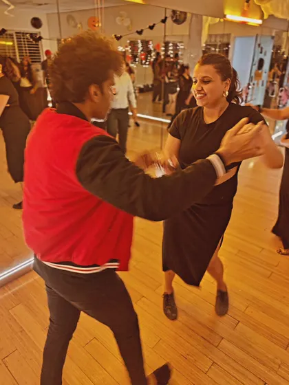 Even with spooky makeup, the joy of dancing shines through. A candid shot from our Halloween social.