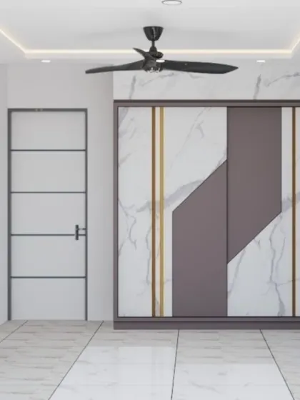 A luxurious wardrobe design featuring marble-patterned sliding doors with geometric gold and grey accents. This piece is designed to be a stunning focal point in a modern bedroom.