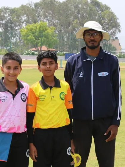 The two opposing captains pose with the umpire before their RSCA League match.