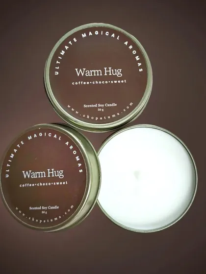 The 'Warm Hug' mini candle, with its cozy scent of coffee, chocolate, and sweet notes.