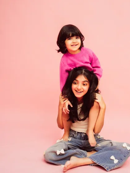A playful moment captured forever. This photo perfectly shows the fun and loving relationship between them.