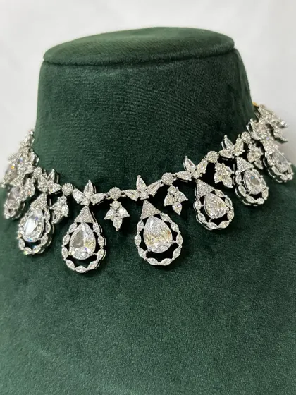 A close-up of an American diamond choker with floral and teardrop motifs. This rental piece is both delicate and sparkly.