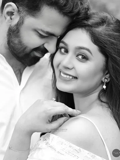 A beautiful moment from an engagement shoot, captured in timeless black and white. Her joyful expression and his gentle touch create a portrait filled with warmth and affection.