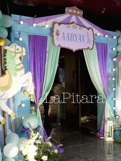 A whimsical carnival entrance with a pastel color palette, featuring classic carousel horses and a striped tent design.