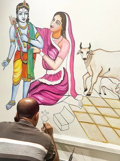 A work-in-progress shot of the Maa Yashoda and Krishna mural. You can see how I build the scene, from the figures to the tiled floor, all by hand with a fine brush.