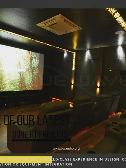 A glimpse of one of our latest home theater projects, featuring warm wood flooring and decorative, backlit wall panels. The design combines modern aesthetics with a comfortable, inviting atmosphere.