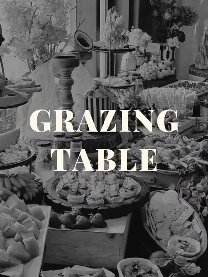 Even in black and white, the beauty and abundance of our grazing tables shine through. This image highlights the rich textures and intricate arrangement of our edible art.