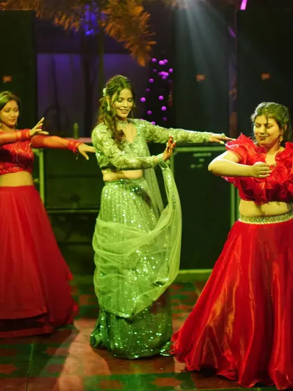 Another angle of the bride and her sisters' performance, showing their beautiful expressions and coordinated movements.