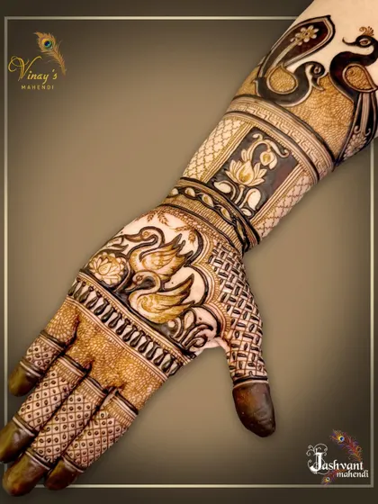 This series showcases a designer mehndi rich with fauna, including peacocks, swans, and elephants, blended with lotus flowers and traditional patterns for a full and festive look.