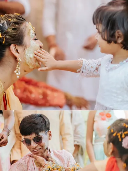 A heartwarming moment where a young child gently applies haldi to the bride's face, showcasing the sweet, multi-generational nature of these ceremonies.