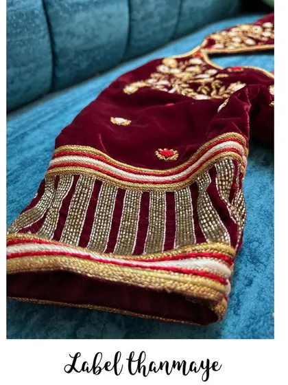This is a close-up of the sleeve detail on a rich maroon velvet blouse. I used intricate beadwork and zardozi embroidery to create a heavy, luxurious look for a wedding.