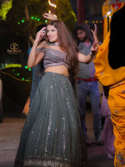 Capturing the style and smiles of the wedding guests. This guest looks radiant while dancing at the Sangeet party.