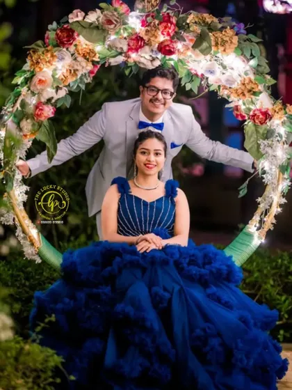 A joyful shot on a swing, showcasing the fully coordinated outfits. From his suit and bow tie to her gown and jewelry, I handle every detail.