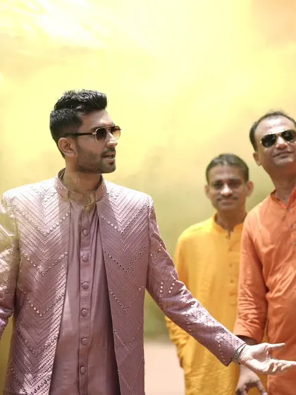 Making a grand entrance is key to setting the tone for the celebration. Here, I'm leading the charge at a Haldi ceremony, making sure the energy is high right from the start with color, music, and a whole lot of style.