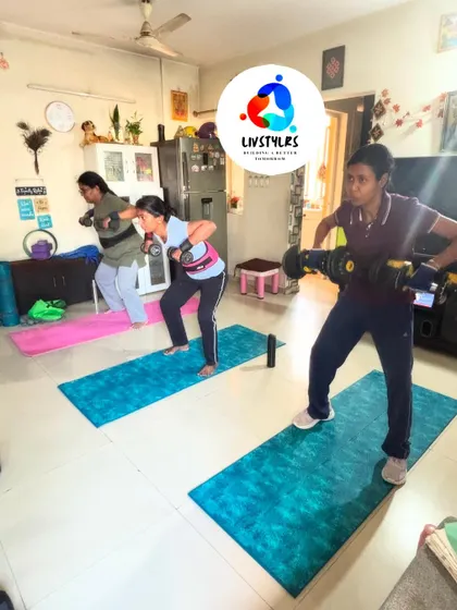 A group of women using adjustable dumbbells for squats. Strength training is a key component of my coaching for women, helping to build muscle and boost metabolism.