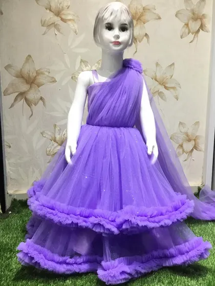 This lavender gown has a draped one-shoulder design and a two-tiered ruffled skirt.