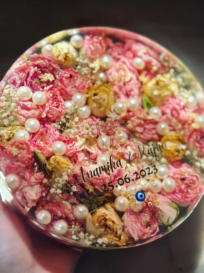 This 7-inch circular block is bursting with vibrant pink and yellow flowers from a varmala, dotted with pearls. The couple's names and wedding date are the perfect finishing touch.