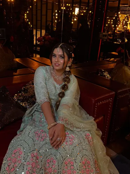 Another seated portrait that captures the full elegance of the party look. The model's makeup is soft and pretty, perfect for a daytime or evening event.