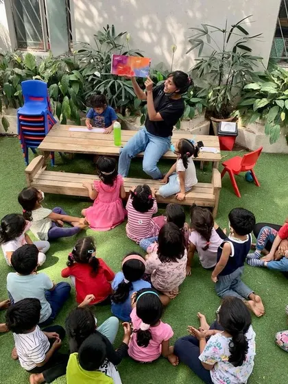 Story time is a cornerstone of our day, especially when celebrating festivals. For Holi, we read a vibrant picture book about how the colors were traditionally made from flowers, connecting the celebration to nature.