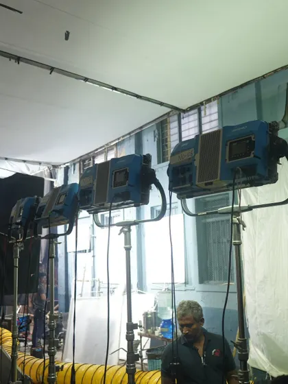 A lineup of ARRI M-Series lights in a studio setting. These powerful HMI fixtures are an industry standard for simulating hard sunlight.