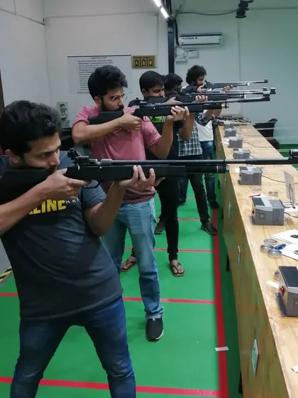 A close-up of a shooter getting into position. Learning the right stance is key to accuracy in air rifle shooting, and it's one of the first things I teach.