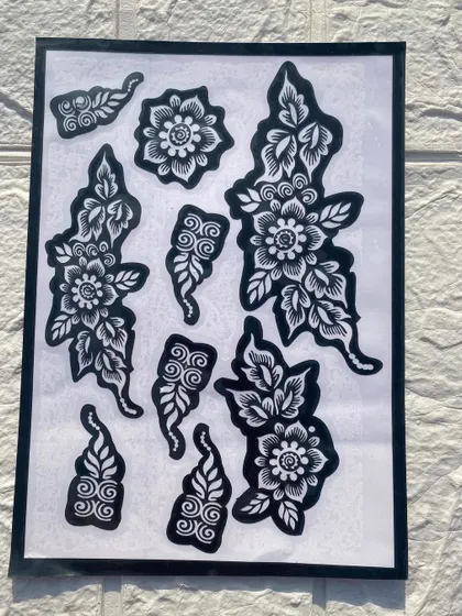 A collection of floral and paisley stencil pieces. These smaller elements are perfect for decorating fingers or creating custom patterns.