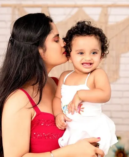 A sweet kiss for a happy baby. I love the genuine emotion in this shot, set against a beautifully styled boho backdrop.