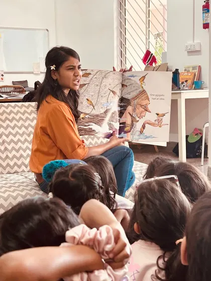 The children are completely engrossed in the story. A good book and a passionate storyteller are all it takes to capture a child's full attention and imagination.