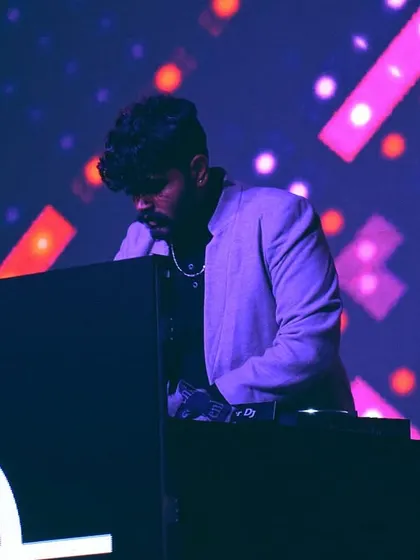 A focused shot of me in the zone during a concert, showing the concentration it takes to deliver a flawless set.