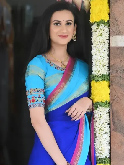 A simple and elegant look for a party. The makeup is clean and fresh, letting her natural beauty and bright blue saree shine.