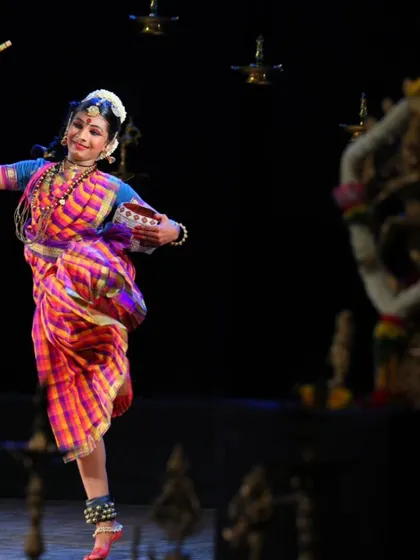 Gowri portraying a character, perhaps Krishna with his flute and butter pot. Storytelling through abhinaya is a magical part of Bharatanatyam.