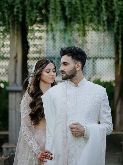 A close, intimate portrait that focuses on the gentle connection between the couple. The soft, natural light and the elegance of their traditional attire come together to create a timeless and romantic pre-wedding photograph.