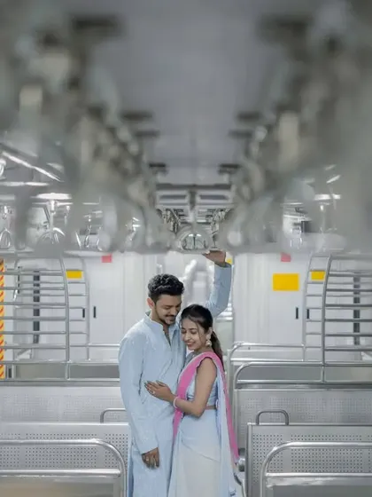 A full-length shot of the couple inside the train, showcasing the unique setting for their pre-wedding photoshoot.