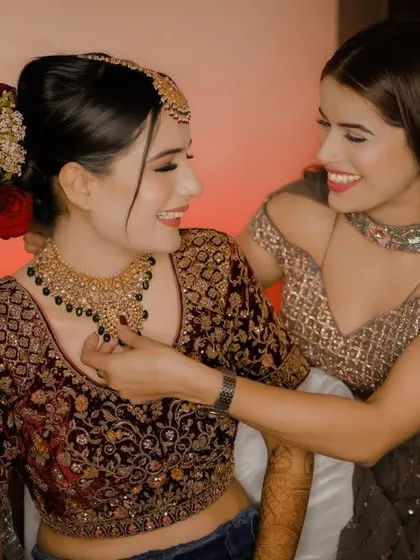 A heartwarming, candid moment between the bride and her sister or friend as they get ready together. These are the memories that last a lifetime.