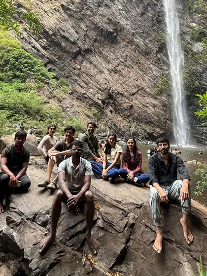 The group relaxing by the Koodluthirtha Falls, a perfect spot to cool off.