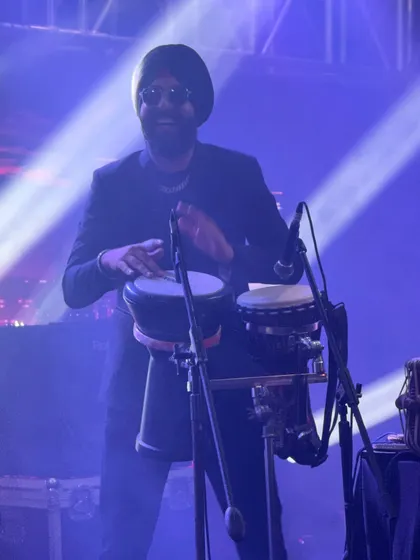 Playing the bongos and darbuka to add a different texture to the music. My setup is versatile for all kinds of party music.