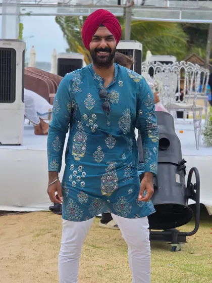 Sporting a traditional kurta for a daytime wedding event. I always make sure my attire fits the theme and formality of the celebration.