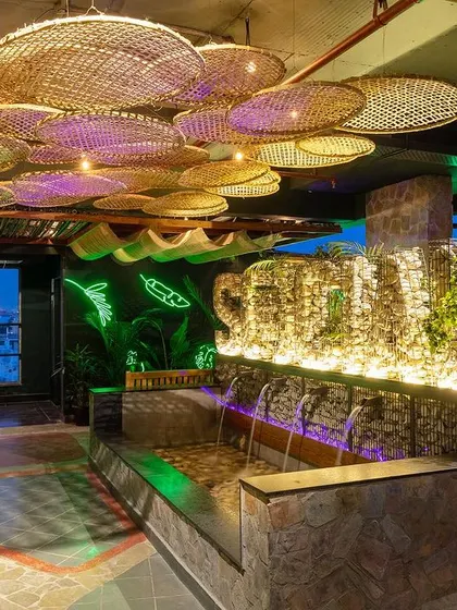 An impressive shot of the water feature and ceiling installation at Social Offline. This highlights the unique architectural and design elements of the space.