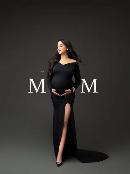 A beautiful full-length portrait of a mamma in a classic black off-the-shoulder gown, with the word "MOM" for a special touch.