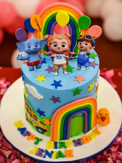 A close-up of the colorful, cartoon-themed birthday cake for Jeniah's party.